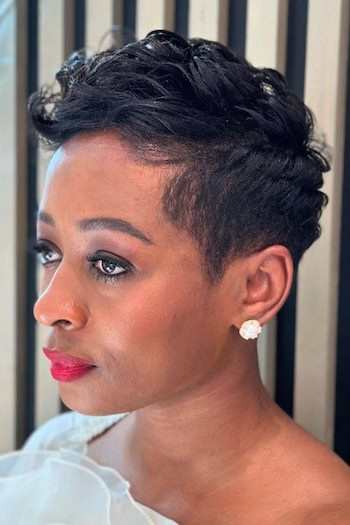 Sculpted Pixie with Defined Curls Haircut, side view.