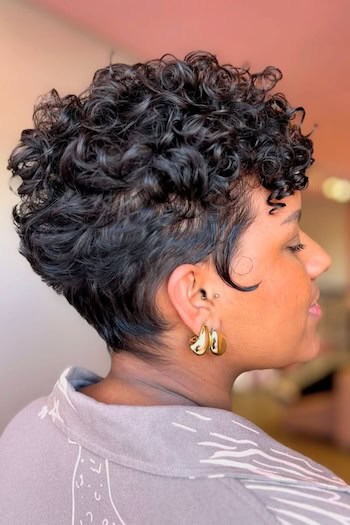 Tapered Curly Pixie with Stacked Back Haircut, side view.