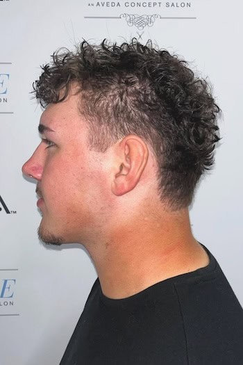 Short Curly Taper with Fade, side view.