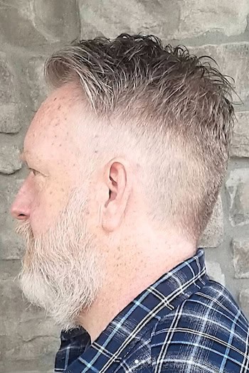 Short Piecey Texture with Mid Fade Men's Haircut, side view.