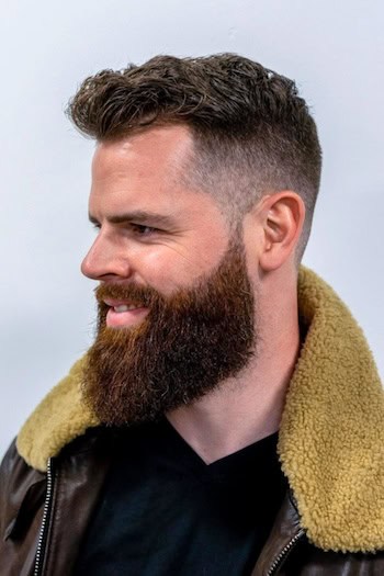 Textured Taper with Full Beard Men's Haircut, side view.