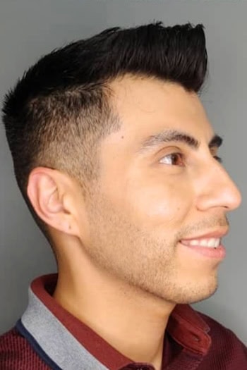 Short Pompadour with Taper Men's Haircut, side view.