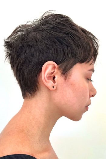 Choppy Pixie with Tapered Nape Haircut, side view.
