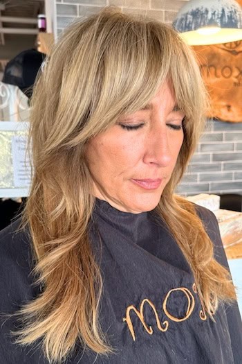 Long Layered Shag With Curtain Bangs Hairstyle