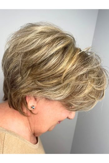 Layered Voluminous Pixie Hairstyle, side view.