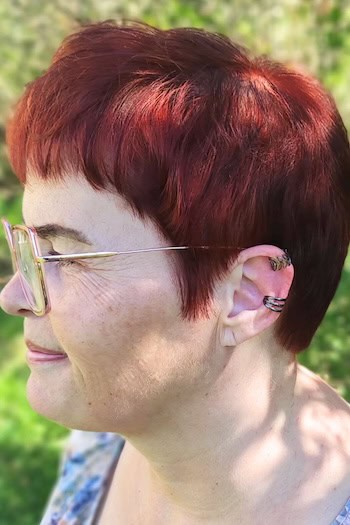 Copper Pixie With Bangs Haircut, side view.