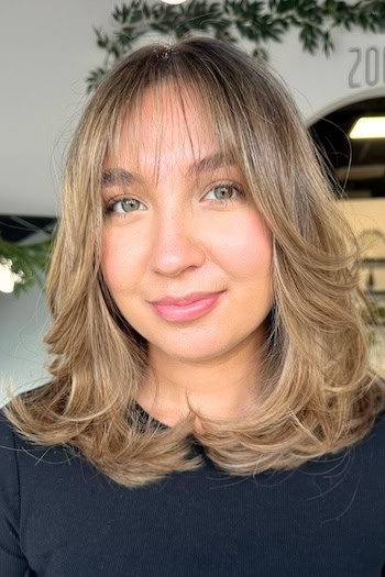 Medium-Length Feathered Cut With See-Through Bangs Haircut