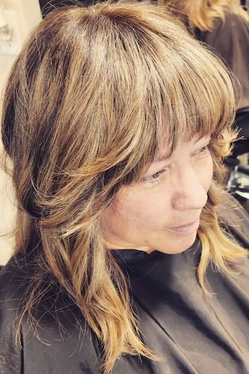 Medium Shag With Curved Bangs And Face-Framing Layers Hairstyle