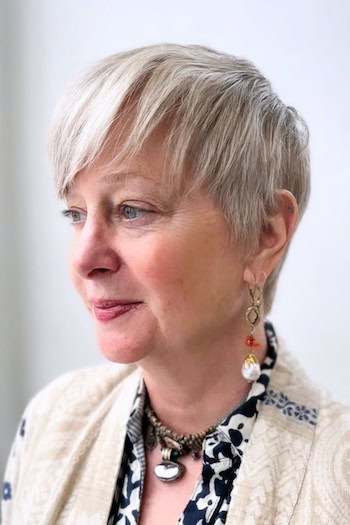 Brushed Forward Pixie With Long Side Fringe Haircut