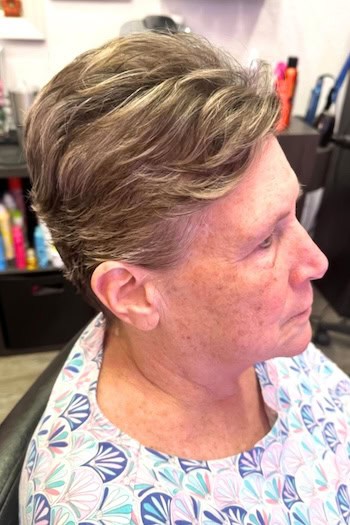 Feathered Pixie With Highlights Haircut, side view.