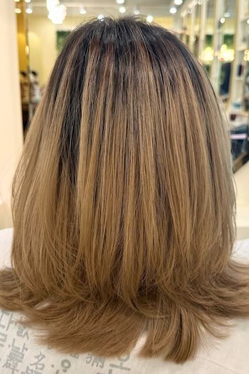 Medium-Length Straight Long Layers With Subtle Flip Haircut