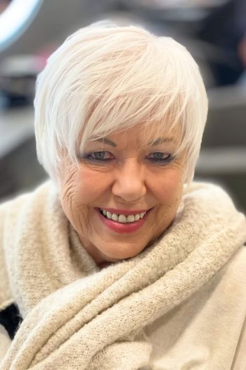 Rounded Layered Pixie With Bangs Haircut