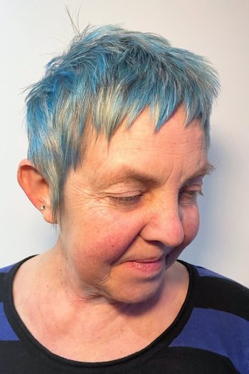 Choppy Silver Pixie With Blue Highlights And Micro Bangs Haircut