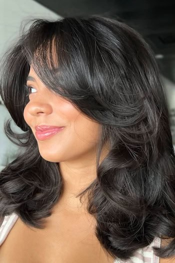 Voluminous Medium-Length Layers With Curtain Bangs Haircut