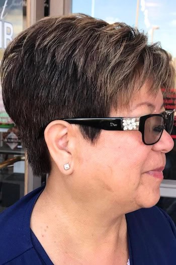 Dark Brown Textured Pixie With Subtle Highlights Haircut, side view.