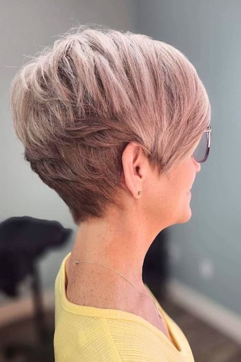 Rose Blonde Pixie With Layers Haircut, side view.