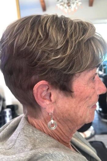 Short Layered Pixie With Highlights and Bangs Haircut, side view.