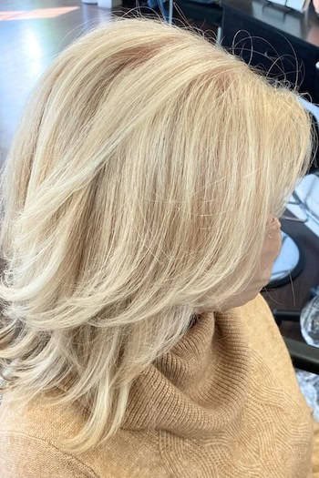 Side-Swept Medium-Length Layers With Feathered Ends Haircut