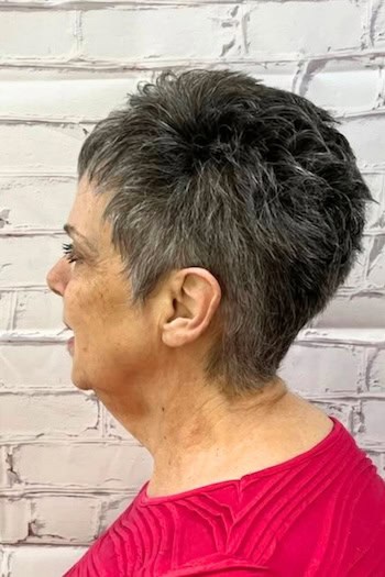 Dark Gray Pixie With Feathered Top Haircut, side view.