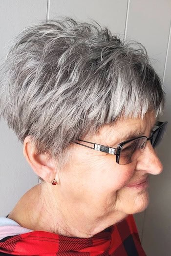 Textured Silver Pixie With Short Bangs Haircut, side view.