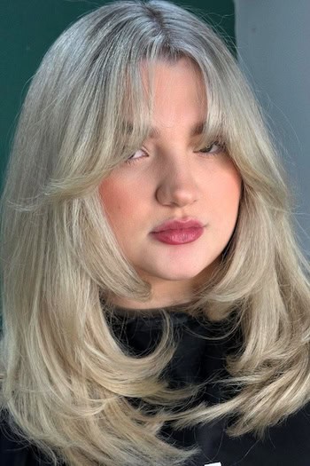 Medium-Length Layers With Curtain Bangs For Thick Hair Haircut