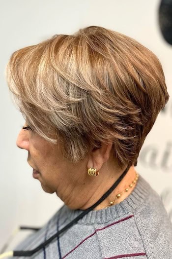Blended Layered Pixie Bob With Highlights Haircut, side view.