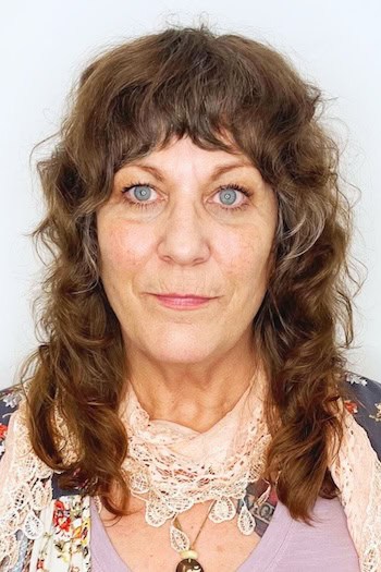 Medium Curly Shag With Short Bangs Hairstyle