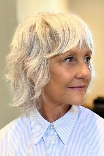 Short Layered Shag With Full Bangs Hairstyle