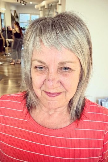 Medium Shag With Feathered Ends And Short Fringe Hairstyle
