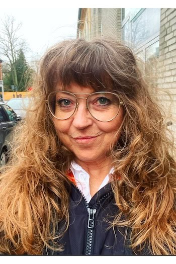 Long Curly Shag With Voluminous Fringe Hairstyle