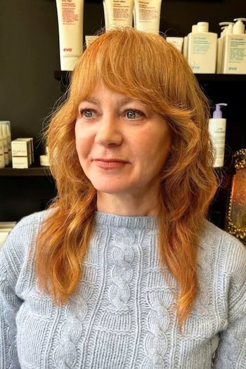 Long Copper Shag With Curved Bangs Hairstyle