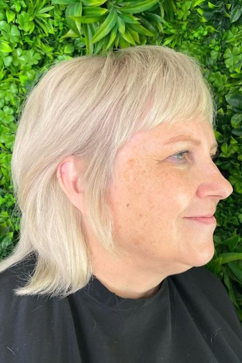 Soft Platinum Shag With Bangs Hairstyle