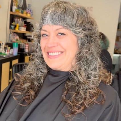 Long Curly Shag With Full Fringe Hairstyle
