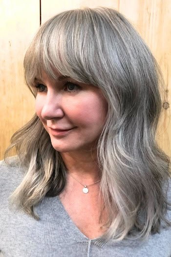 Silver Shag With Full Soft Waves And Bangs Hairstyle