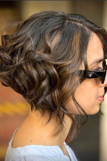 Wavy Brunette Inverted Bob Hairstyle, side view,