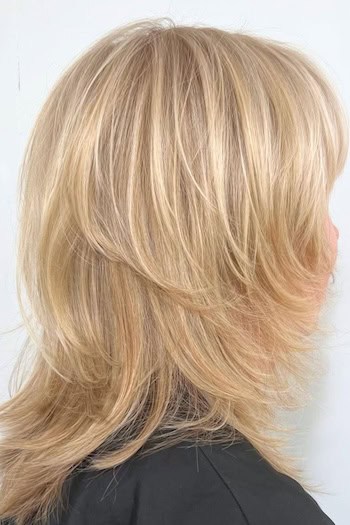 Blonde Shaggy Lob with Highlights Haircut, side view.