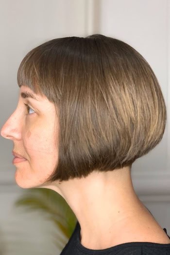 Jaw-Length Bob with Bangs Hairstyle, side view.