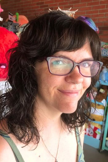 Curly Medium-Length Shag with Side Curtain Bangs Haircut