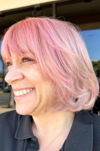 Short Pink Bob with Bangs Hairstyle