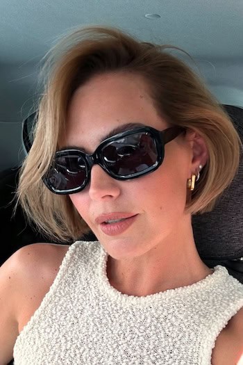 Jaw-Length Bob With Side Part Hairstyle on a woman wearing sunglasses.