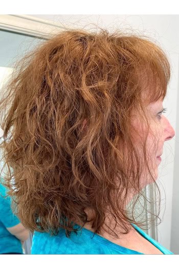 Shoulder-Length Curly Shag With Bangs Hairstyle