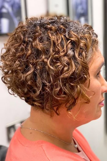 Curly Short Angled Bob Hairstyle, side view.