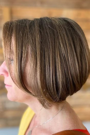 Stacked Bob With Highlights Hairstyle, side view.