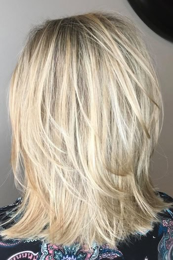 Layered Straight Medium-Length Hair Cut For Volume Hairstyle