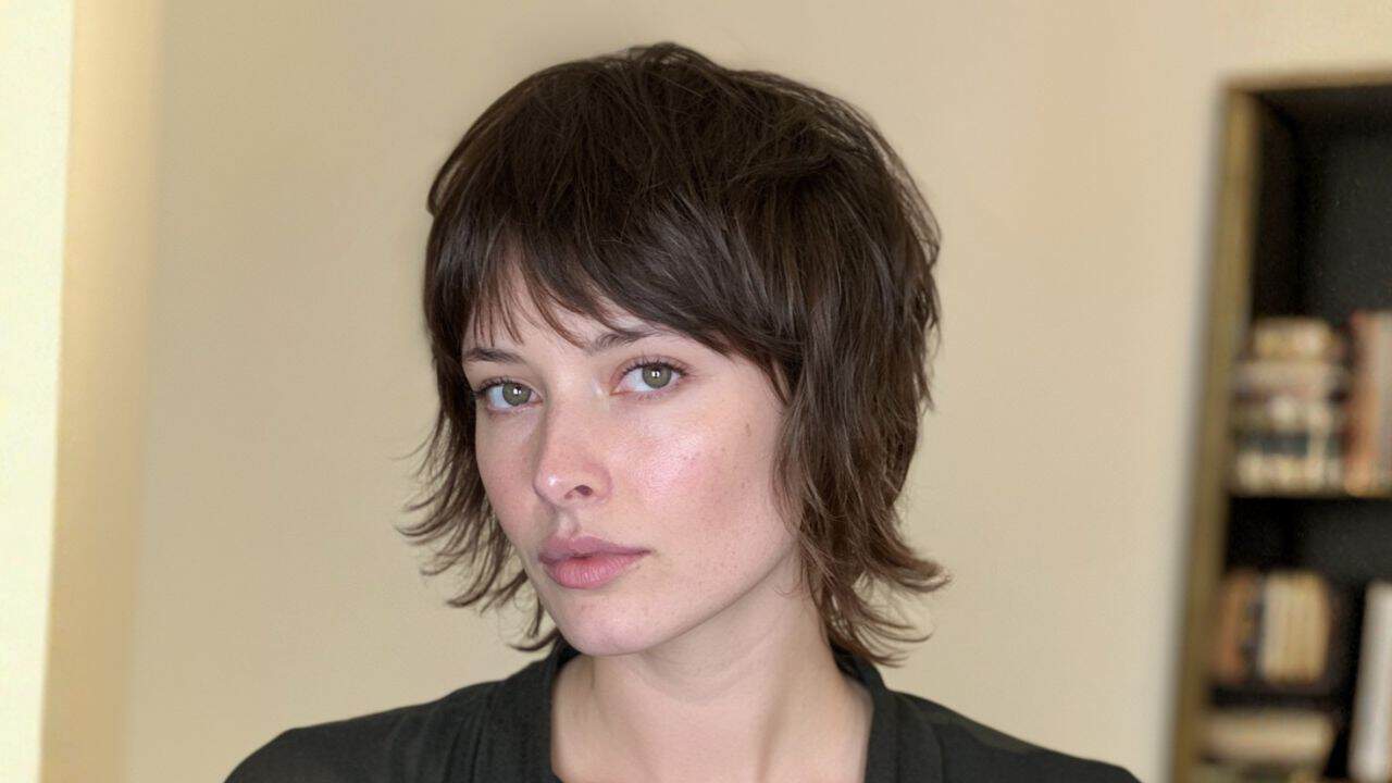 Short shag hairstyle on a woman with dark brown hair.