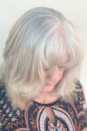 Medium-Length Layers With Rounded Bangs Haircut