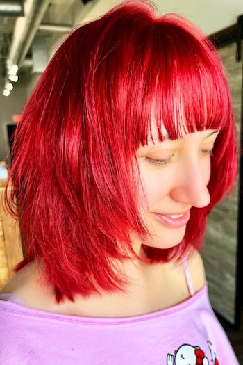 Vibrant Layered Bob With Blunt Bangs Haircut