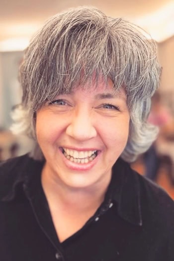 Short Feathered Gray Shag with Full Bangs Hairstyle