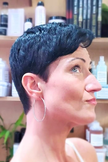 Wash-And-Wear Pixie Hairstyle on dark brown hair, side view.