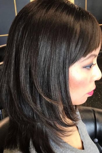 Smooth Mid-Length Layers With Bangs Haircut
